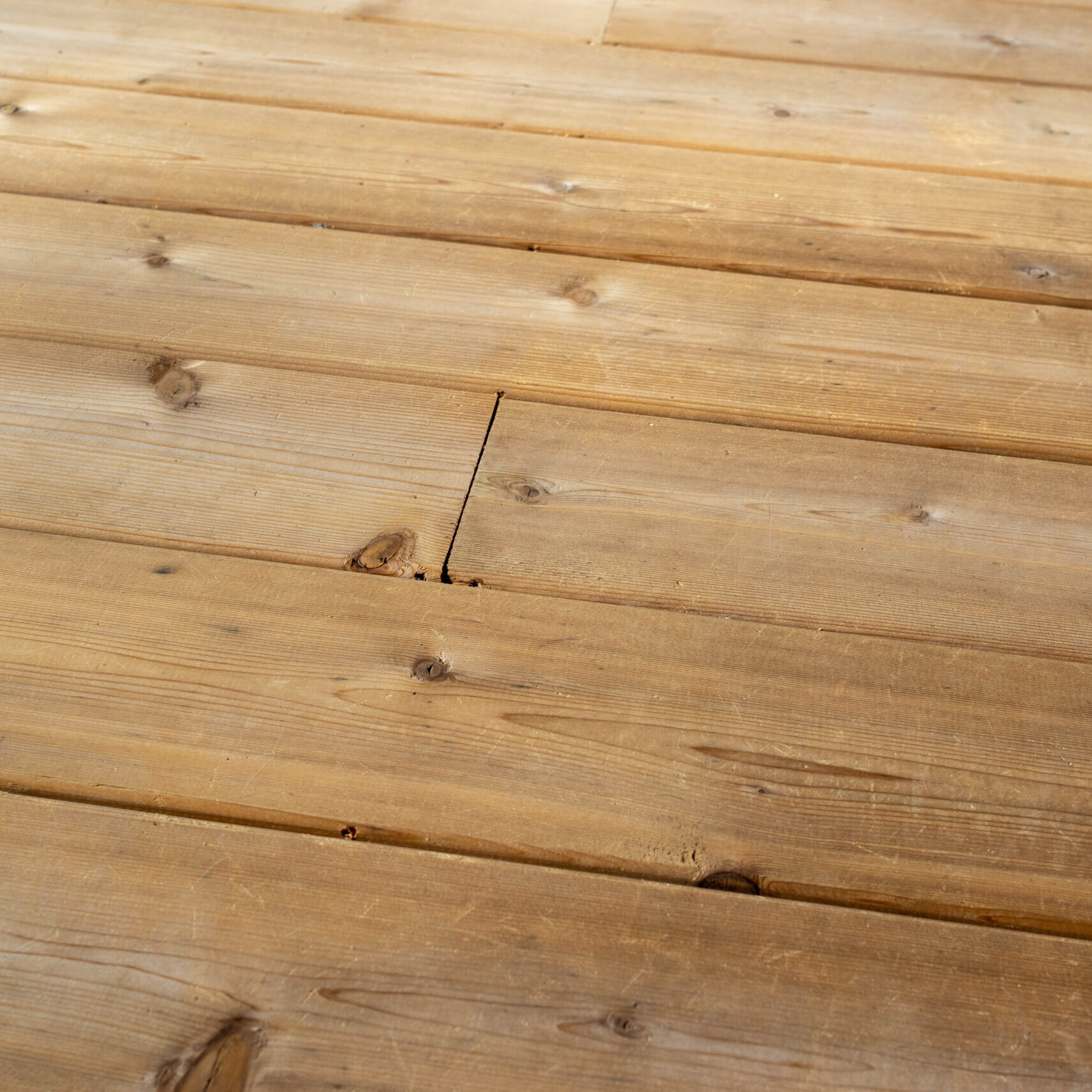 Pressure-treated wood deck boards