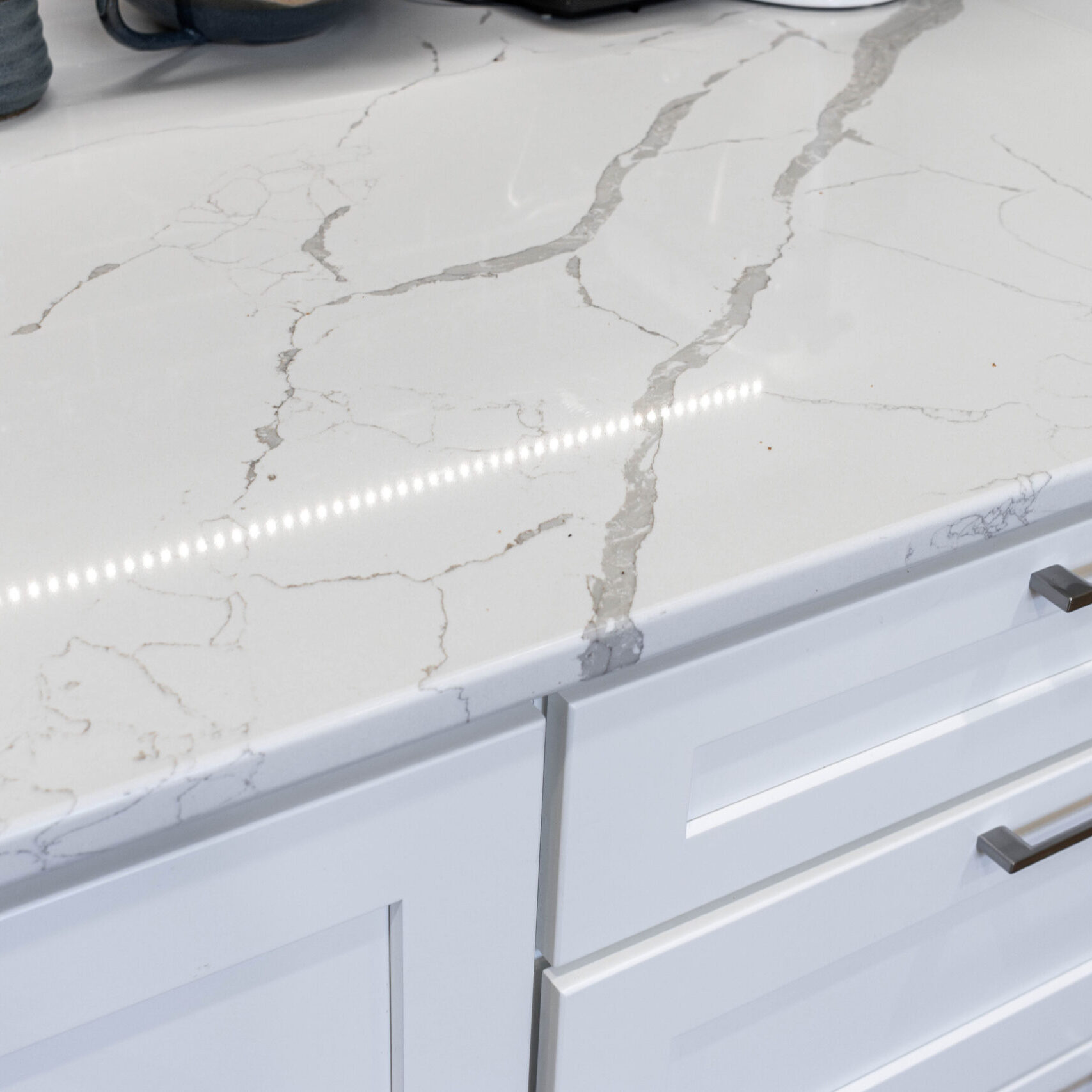 Modern kitchen quartz countertops with subway tile backsplash